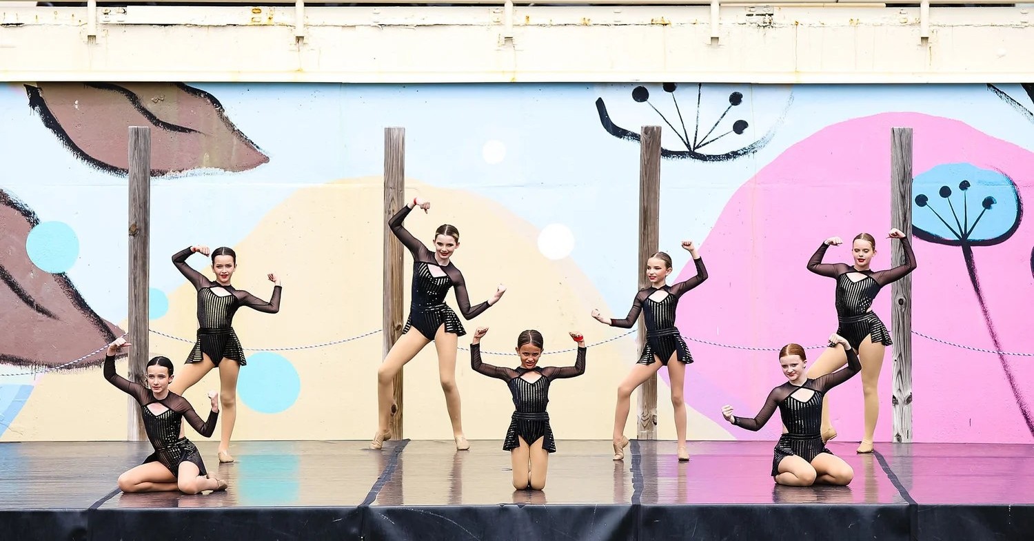 Newman Dance Center dancers performing together on stage